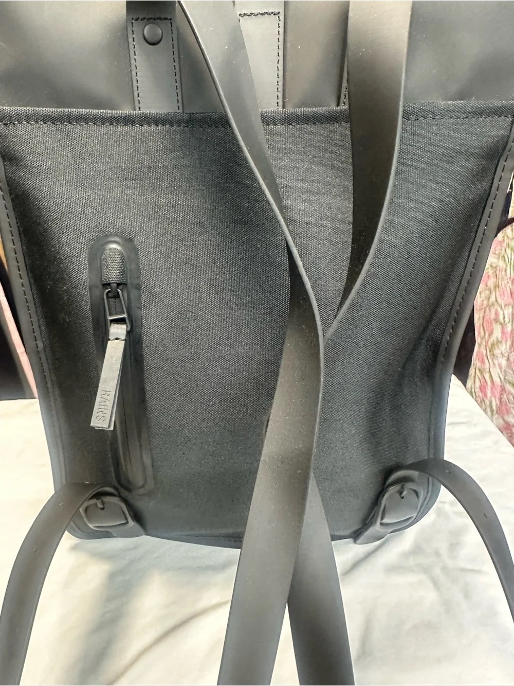 Rains  Backpack is clean and ever-contemporary. Like new no tag